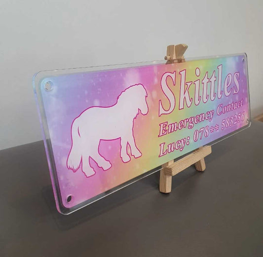 Rainbow Skittles Design Sign with White Text