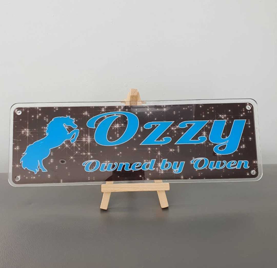 Ozzy Design Black Sparkly Effect Background with Blue Text