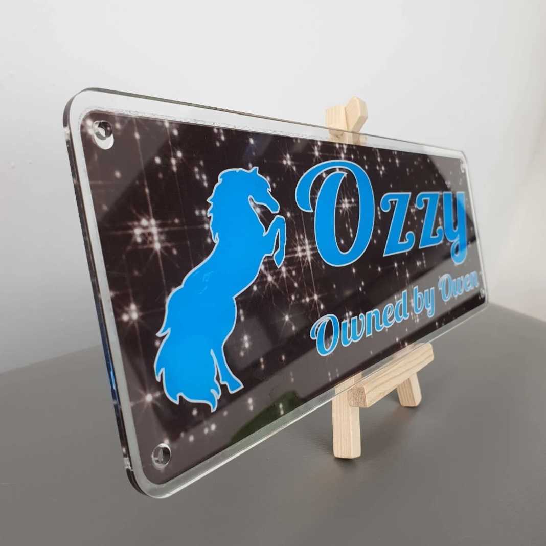 Ozzy Design Black Sparkly Effect Background with Blue Text